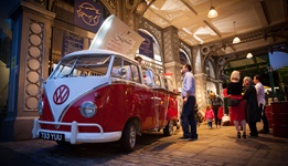 People line up for B.O.B.'s Lobster pop-up food truck in red 1957 VW van in London, England