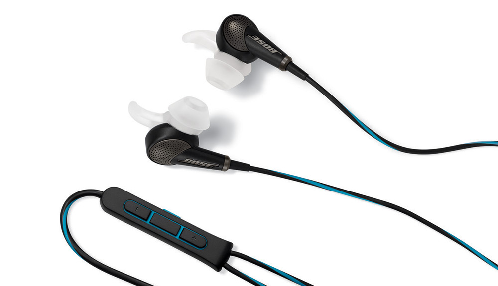 Bose QuietComfort 20 Noise Cancelling headphones laid out on white backdrop