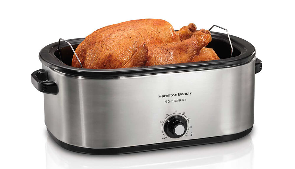 Turkey in a roaster oven being cooked