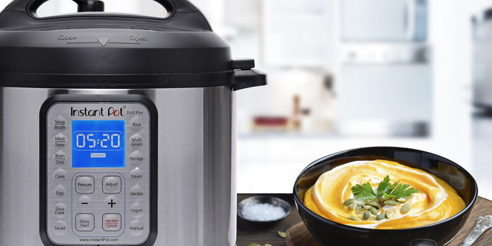 The 9-in-1 Instant Pot seen on a counter, a golden curry with yogurt and fresh herbs in a bowl beside it