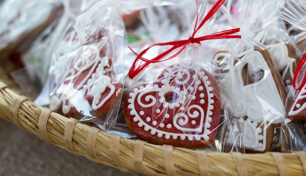 Packages of homemade cookies piled in woven basket