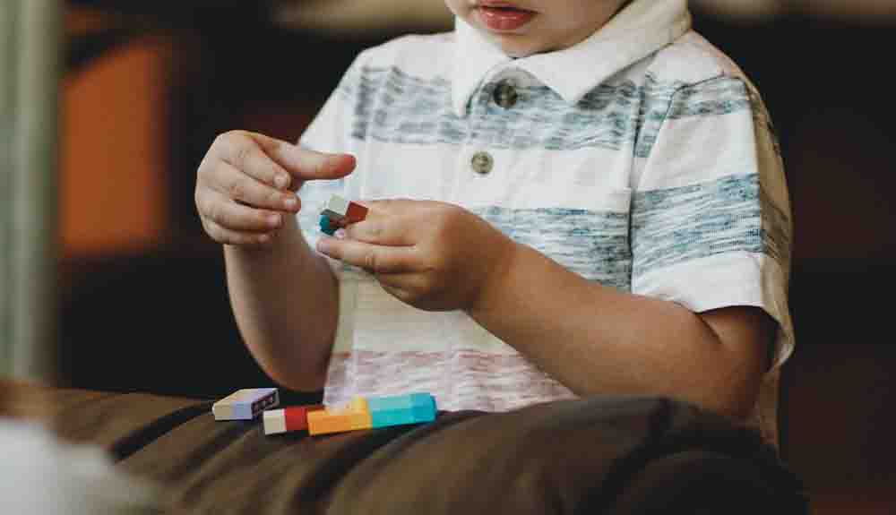 A child playing with a puzzle.