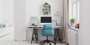 A home office is shown with white furniture and a blue chair