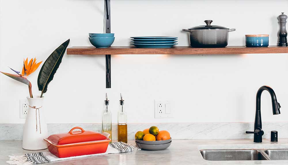 Open shelves are shown in a kitchen