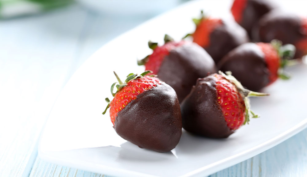 A plate for chocolate covered strawberries are shown