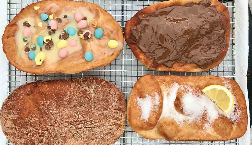 An overhead photo shows four beaver tails with different toppings like chocolate and granulated sugar