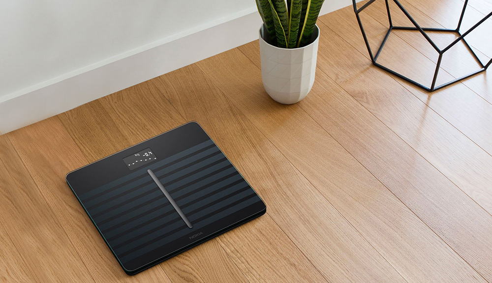 The Nokia Body Cardio scale on a hardwood floor