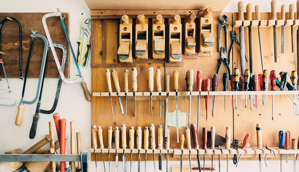 Tools organized neatly on wall mounted storage system