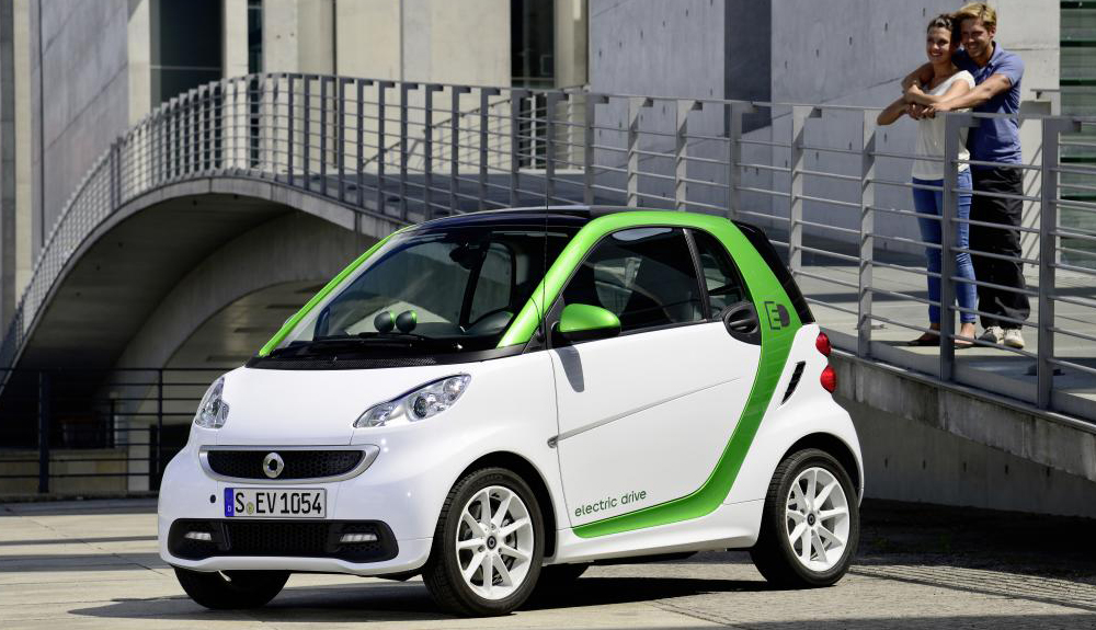 A white and green Smart fortwo