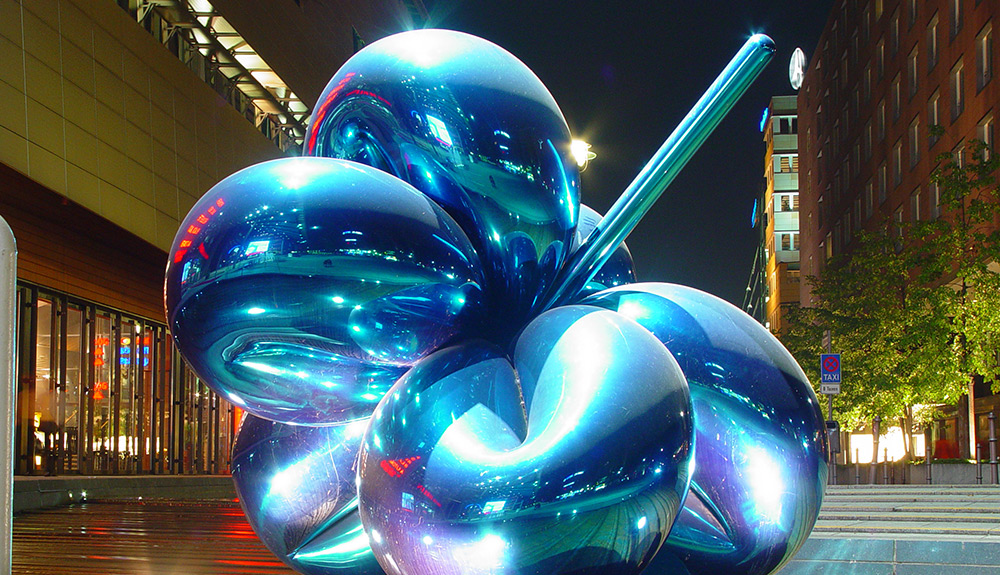 A large balloon sculpture shines in the evening light outside the Daimler Contemporary Museum in Berlin, Germany