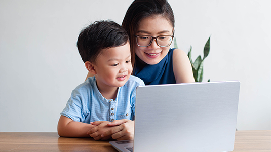 Mother and son on a laptop