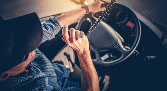 Truck driver using radio to communicate