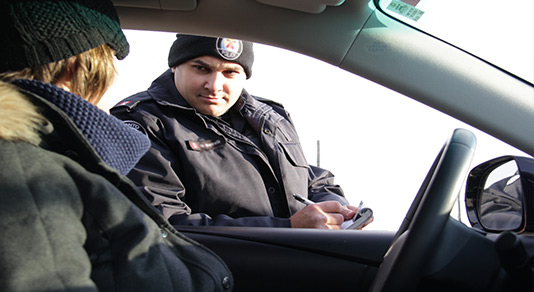 Police office giving a ticket