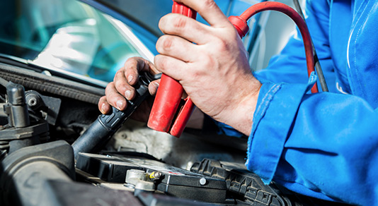 Servicing a car battery.