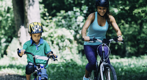 Mother and son riding bikes.