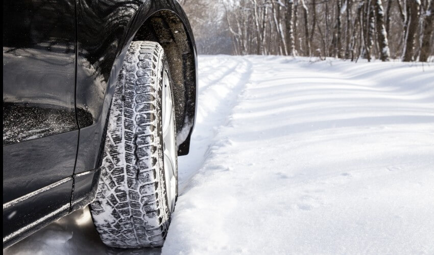 Image of winter tire in the snow.