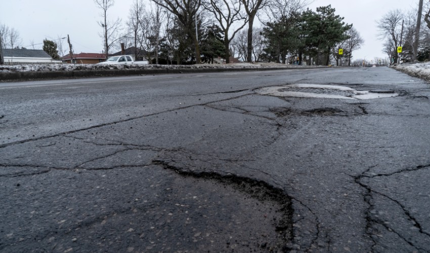 Cracked roads on a residential street.