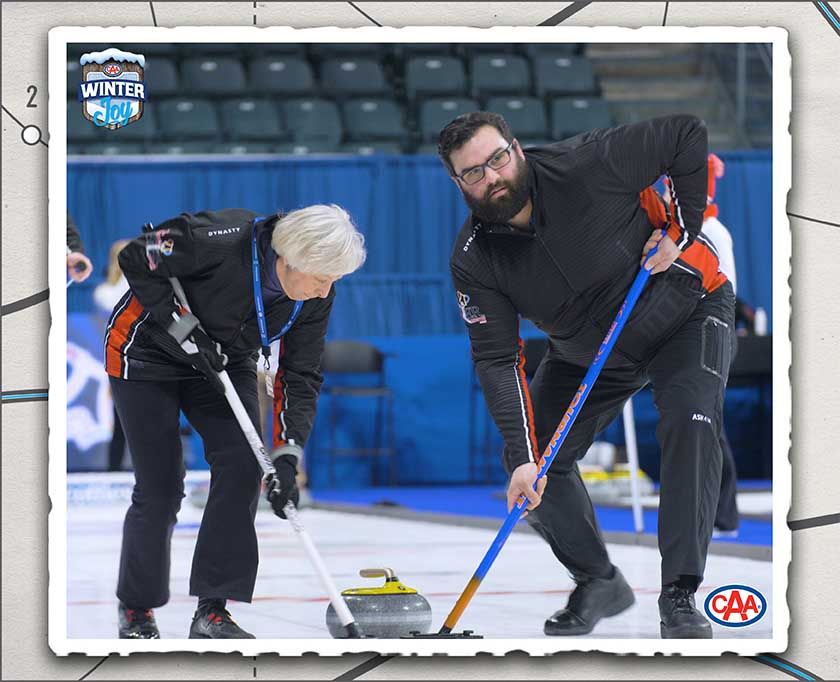 Two people curling.
