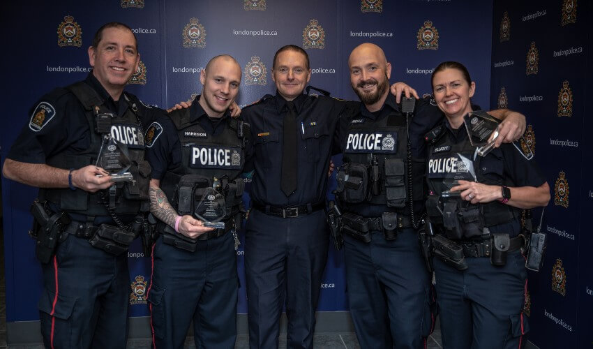 London Police Service officers pose with CAA School Safety Patrol Award at January 23 ceremony.