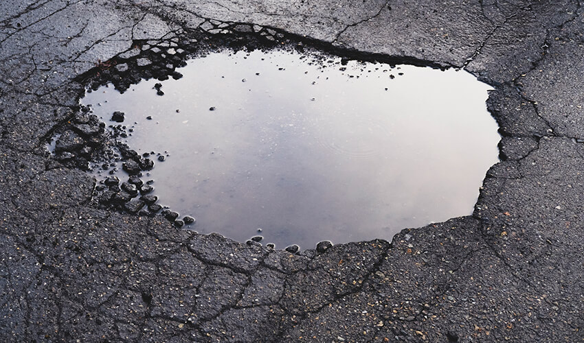Road with a pothole.