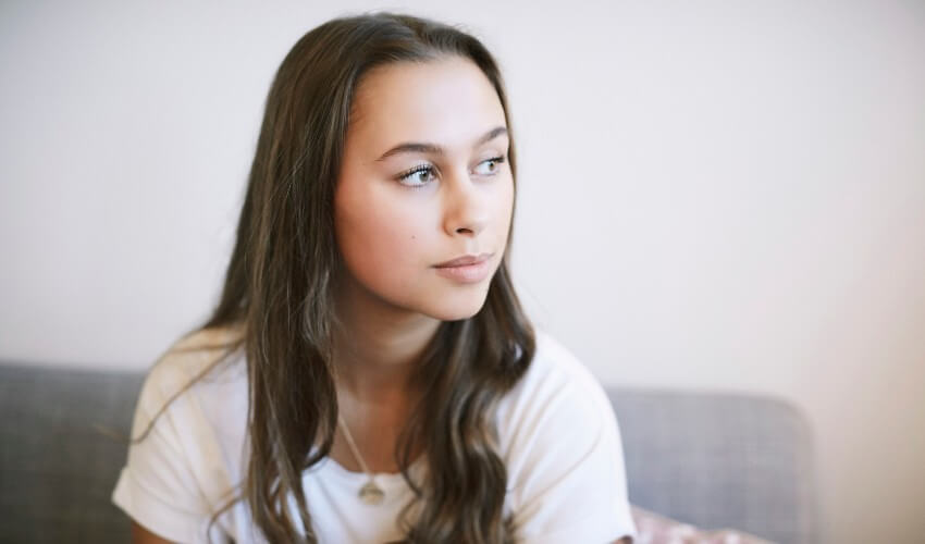 Woman sitting at a wellness centre.