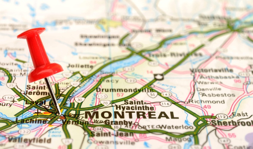 Map of Montreal with a pushpin marking the city.