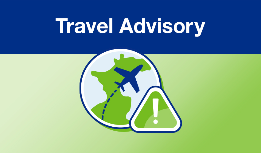 Travel advisory illustration of a plane flying over the globe and an exclamation mark warning sign.