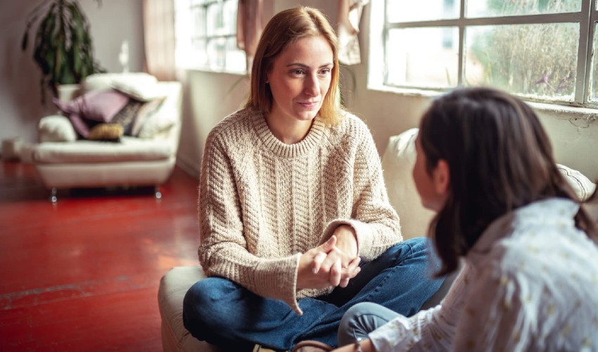 Mother listening to teen daughter.