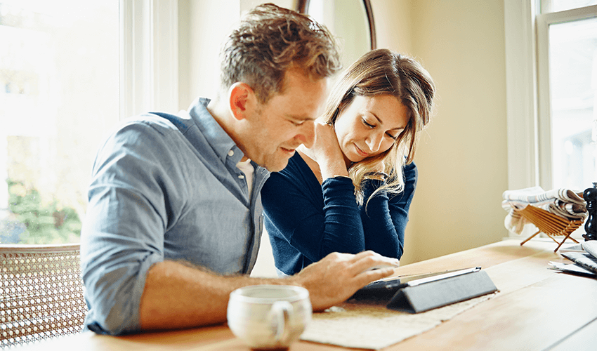 Young couple looking at tablet