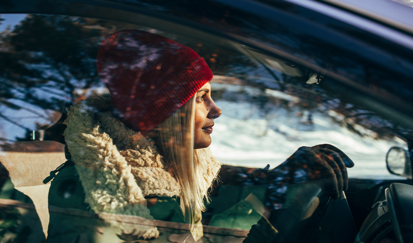 Female driver in car in winter