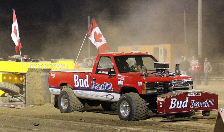 Monster truck on dirt speedway.