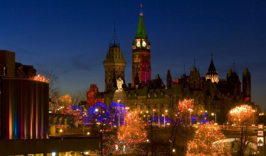 Festive holiday lights illuminate Parliament Hill in Ottawa.