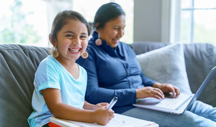 Happy Native American girl spending time with her mom