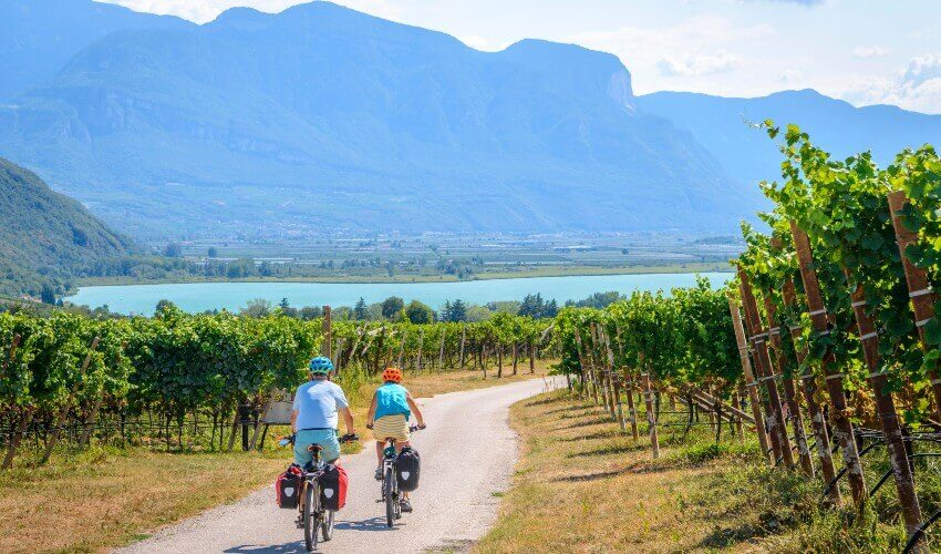 Two cyclists on the Via Claudia Augusta cycle path in South Tyrol, Italy.