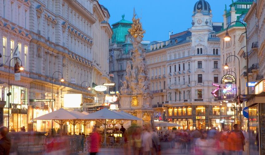 Pedestrian shopping mall in Vienna at dusk.
