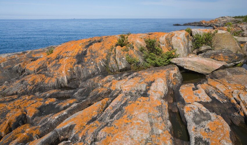Ancient volcanic rock formations on Georgian Bay in national park.
