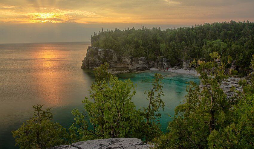 Elevated view of sunrise over rocky shoreline of Bruce Peninsula National Park.