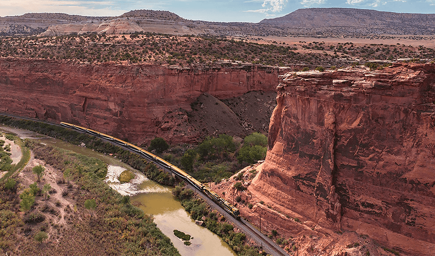 Rocky Mountaineer train against red rocks