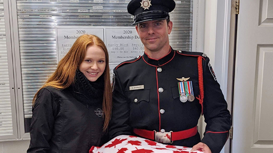 Faith Dickinson posing with officer