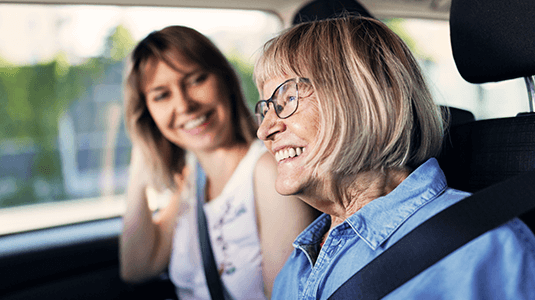 Mother and adult daughter in a car