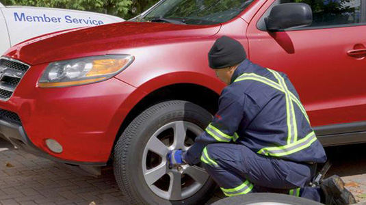 A mechanic fixing a car tire