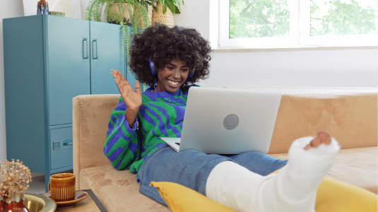 Person sitting on a chair with their laptop