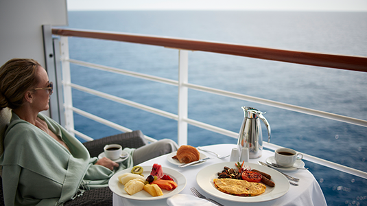 Eating dinner on a balcony on a cruise ship
