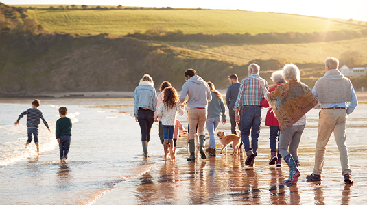 Large family walking on the beach