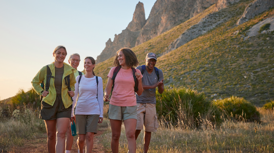 Hikers walking in a field