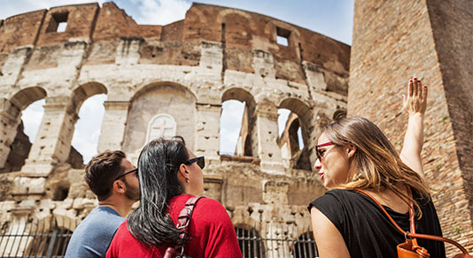 Tourists with a guide in front of the Coliseum, Rome