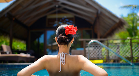 Woman relaxing in a pool