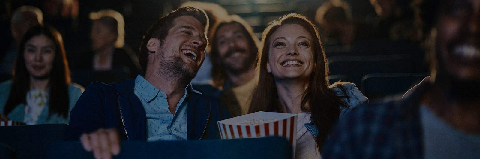 Couple watching a movie at the theatre