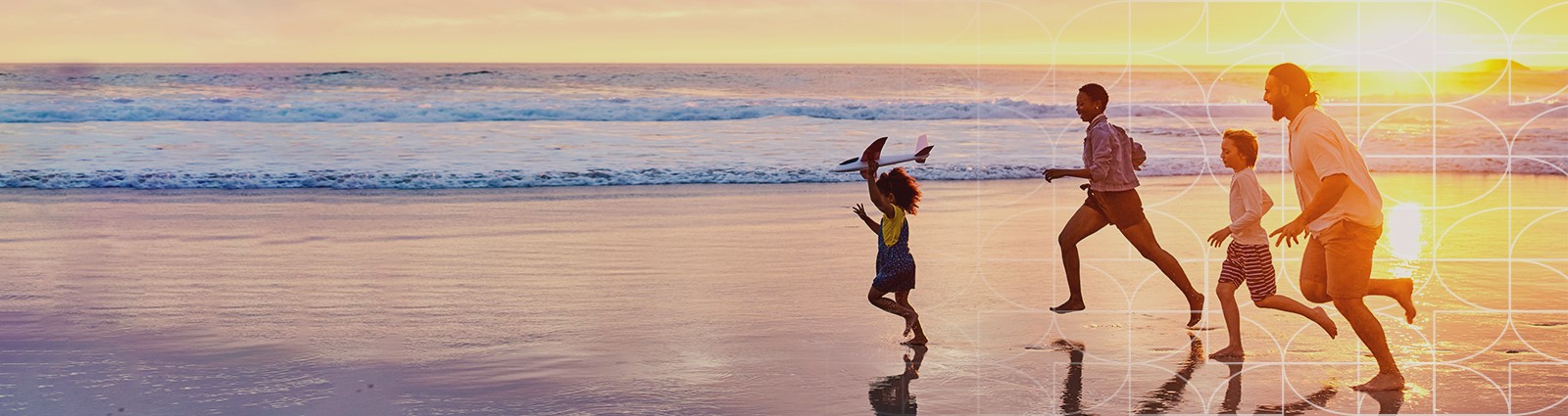 Family Running on the Beach