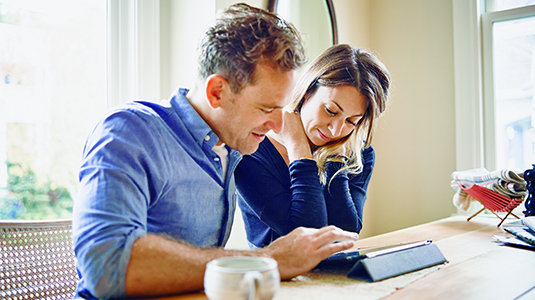 Family looking on the details on their insurance.